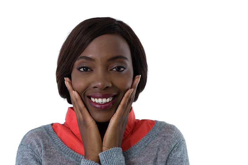 Smiling woman touching jaw TMJ relief