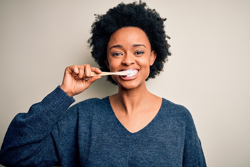 Woman brushing her teeth